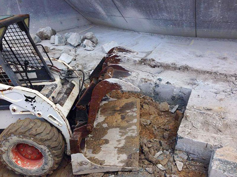 A bulldozer is working at a gallery.